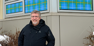 Dr. Barry Clarke in front of Northwood