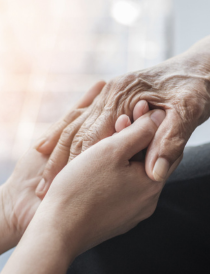 elderley hand holding a younger hand