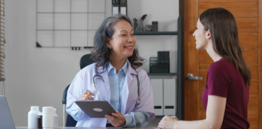 female physician counselling a female patient