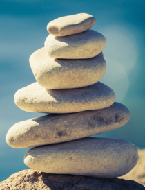 a stack of rocks increasing in size going up