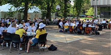 Dalhousie Medical School Class of 2025 socially distanced at tables outside