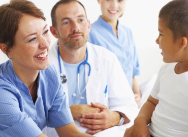 image of doctors wiht young patient