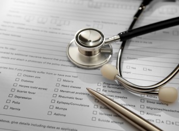 stethascope ontop of a medical form